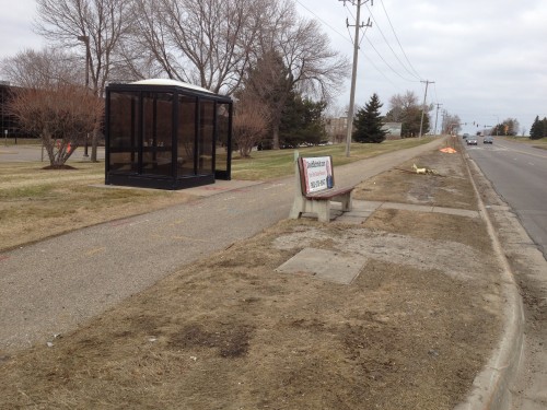 This may be a bus stop? Transit maps are agnostic on the issue. +1 for trash can in the shelter