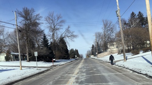 Image of man walking in street