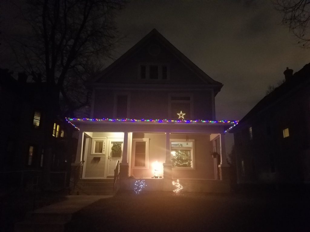 Front of a single family home with christmas lights