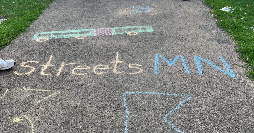 Sidewalk chalk that reads Streets.mn