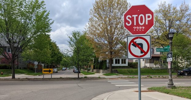 A stop sign is shown with question marks superimposed on its surface to imply that the nature of them is changing.