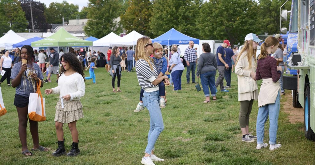 A crowd of people at Mac-Grove Fest, held every September.