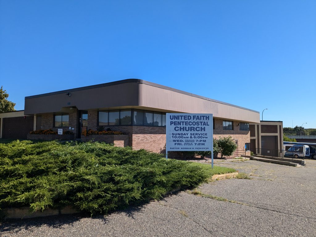 The United Faith Pentecostal Church and the green shrubs that adorn the parking lot.