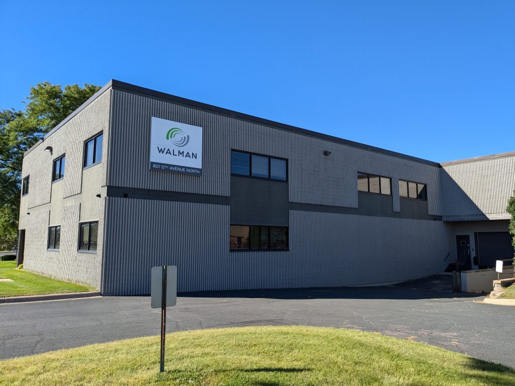 The Walman Optical building, with ample windows and gray siding