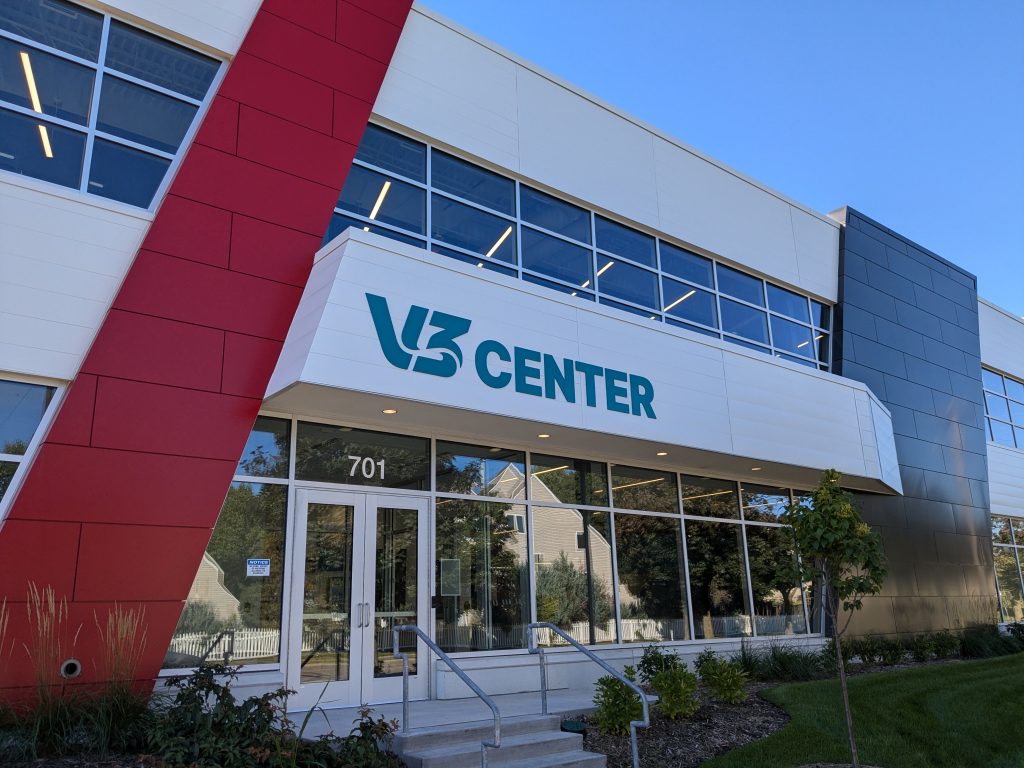 A business called the V3 Center, with red and blue blocks flanking the front door.