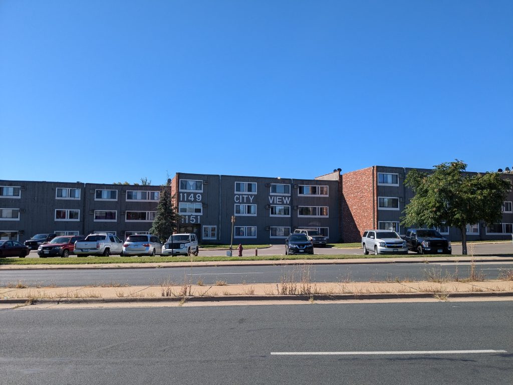 The City View Apartments have the numbers of their street address prominently displayed: 1149-1151.