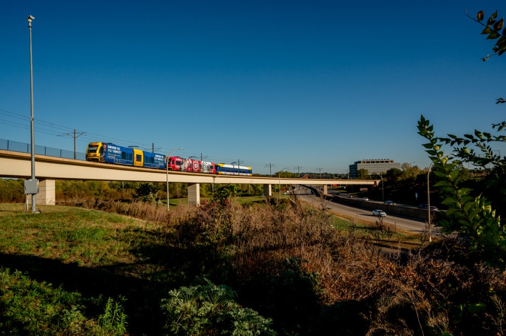 A Blue Line train passing over Highway 62.