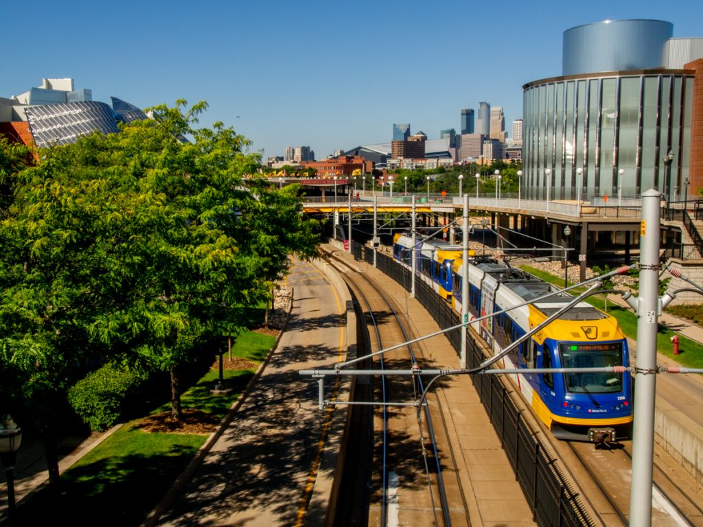 A Green Line train heading toward the Washington Avenue bridge and downtown Minneapolis from the East Bank campus.