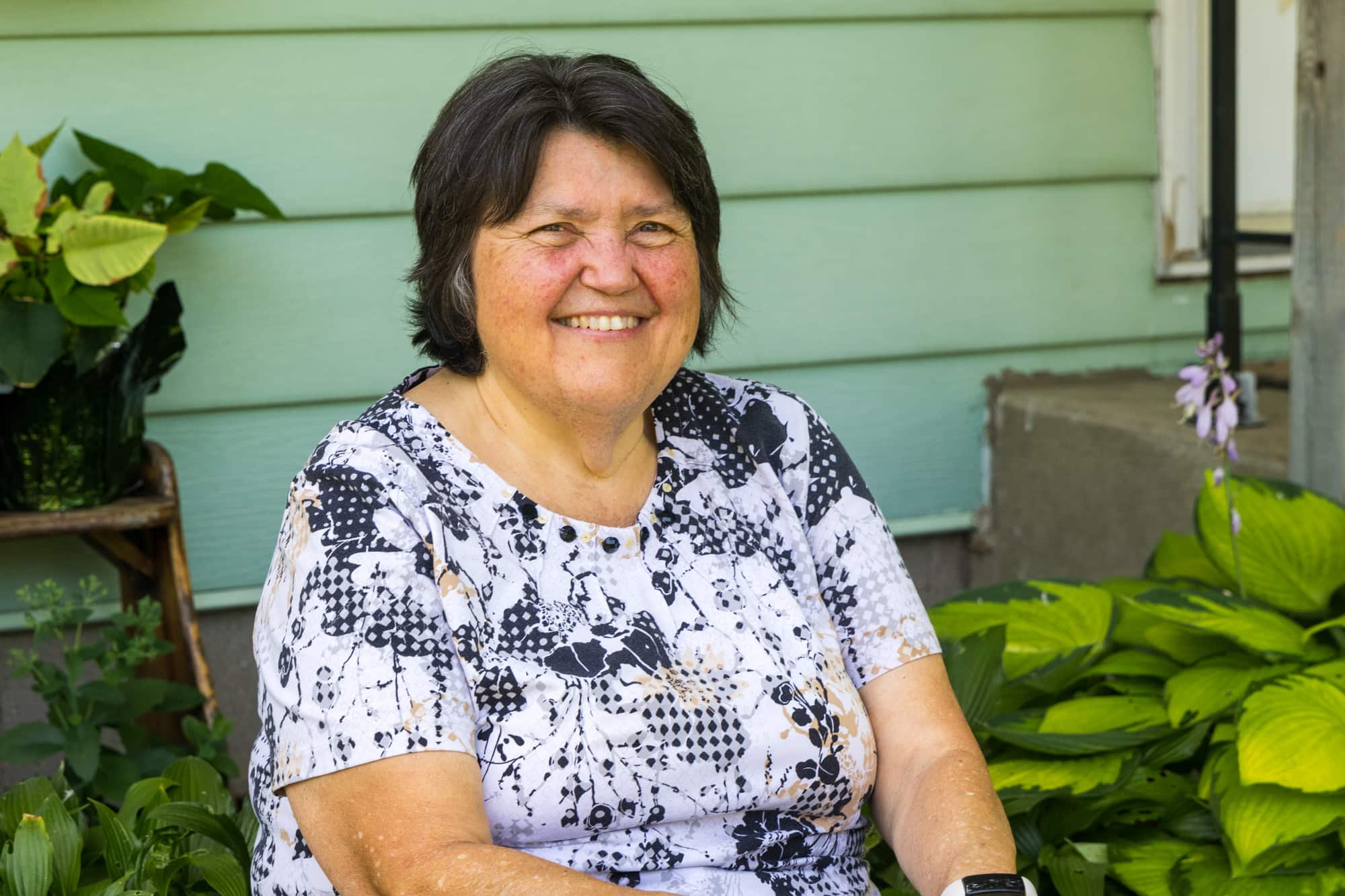 Joan (Wilhelmy) Ballanger in front of her home.