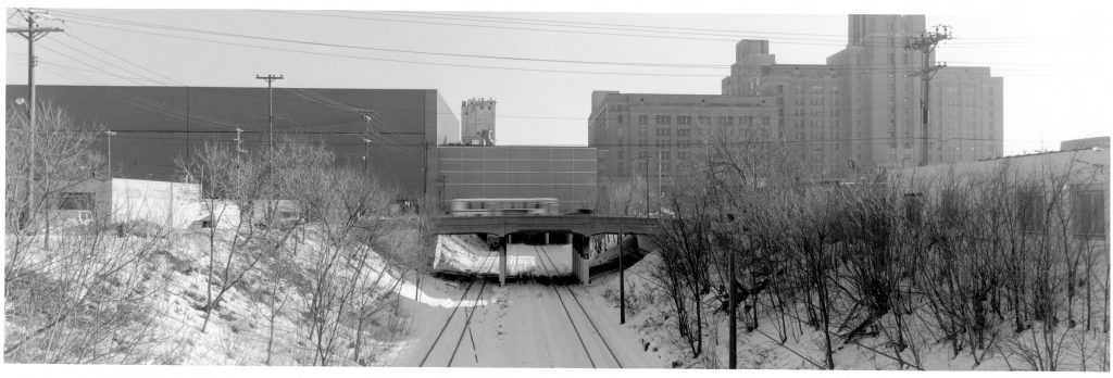 Looking east towards the Sears complex with the large 190s building, warehouse over the tracks, and large warehouse to the North. The grain elevator beyond is visible too.