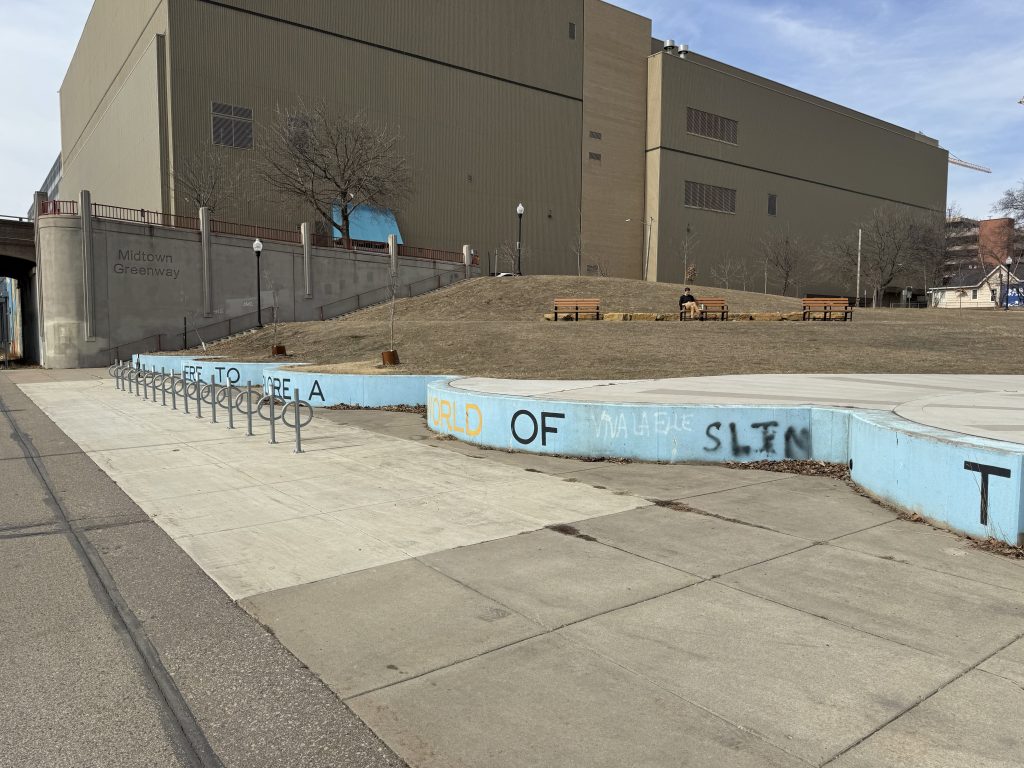 Footings of former grain elevators, bike racks, and a hill make up the Cepro Site park.