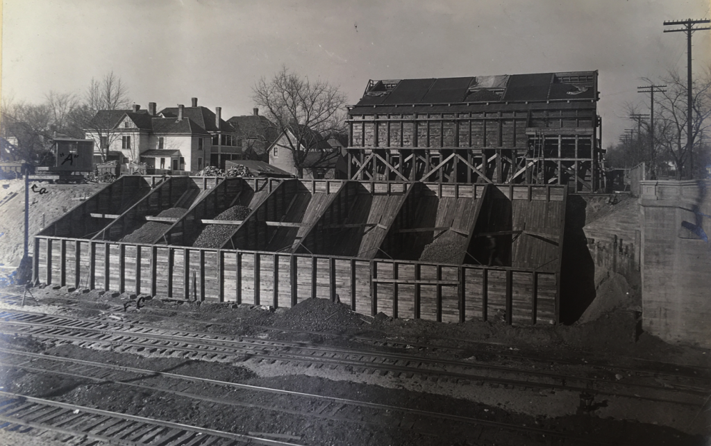 Elliot Fuel Company storage bins built into the sloped wall of the trench.