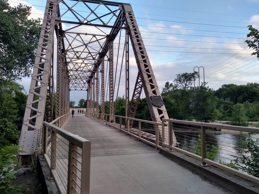 steel truss bridge with pedestrian trail