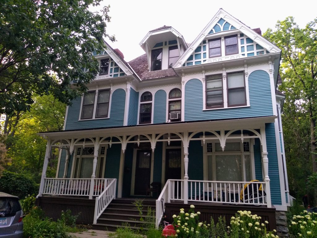 Blue Queen Anne two-and-a-half-story duplex