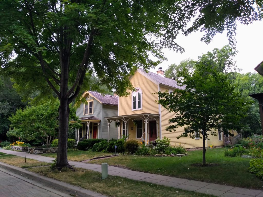 two two-story houses combining greek-revival and italianate elements