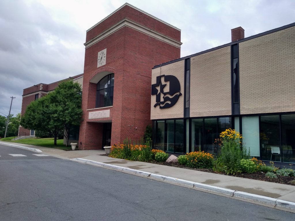 building with name and logo of DeLaSalle High School