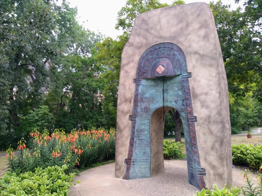 arch with bell built into it in garden