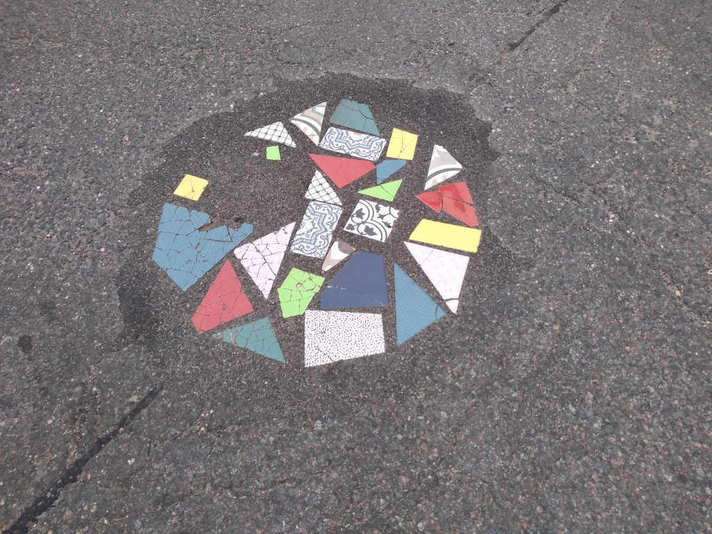 multi-colored shard patch to asphalt