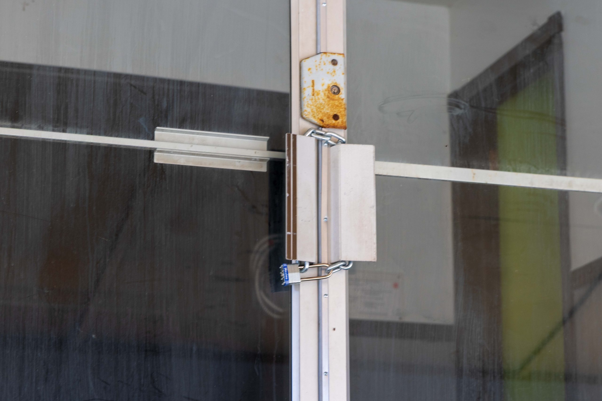 Chain and lock on door of 1003 Arcade.