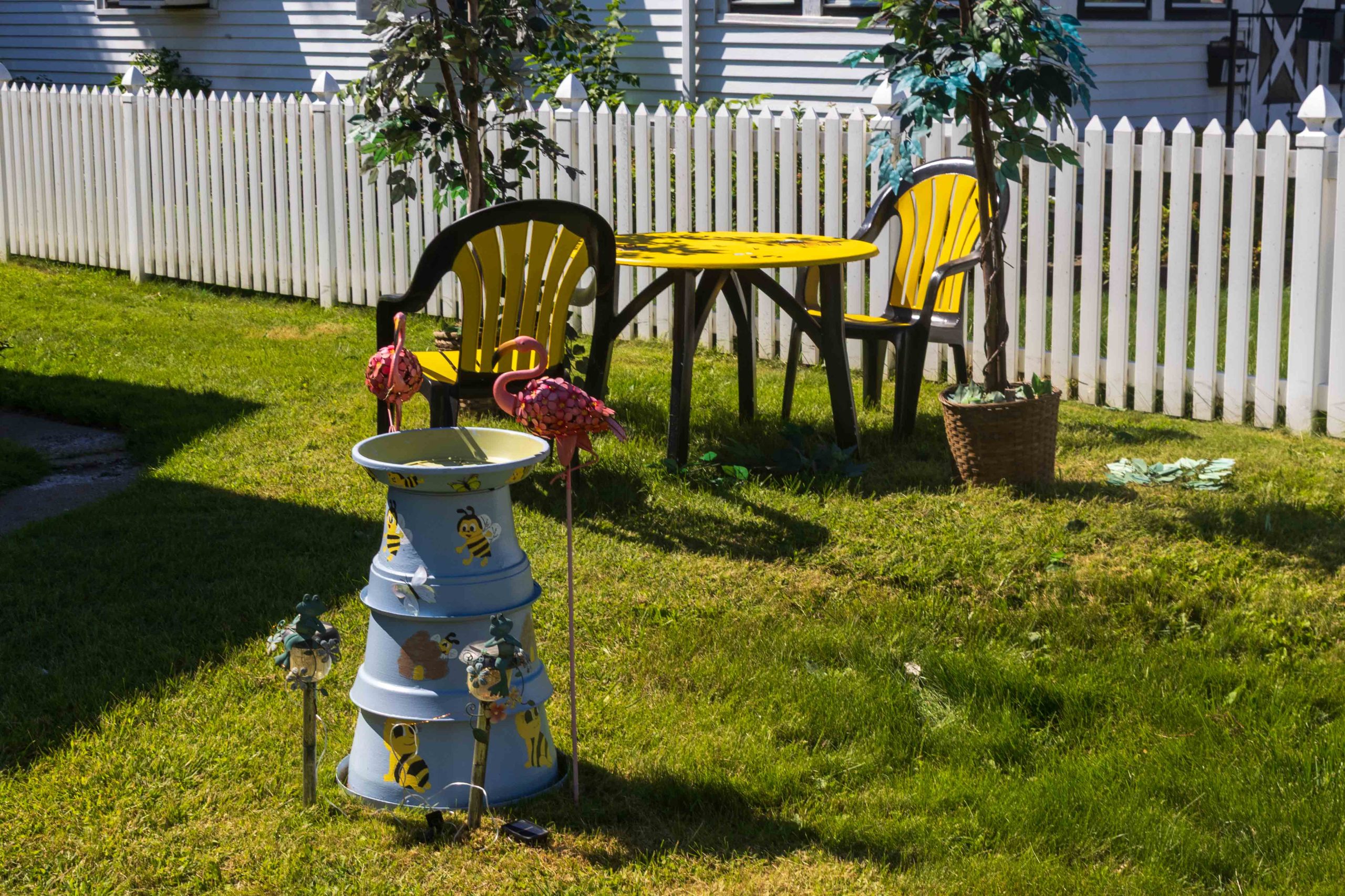 Table and chairs painted yellow and brown for bee theme.
