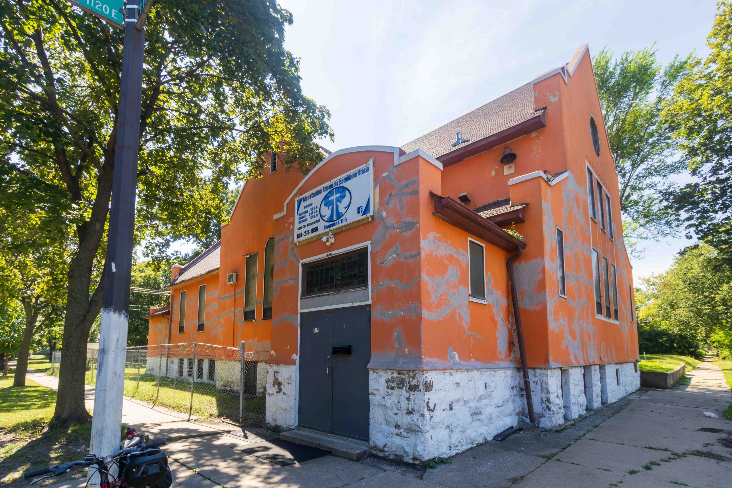 Small tangerine orange church building at 815 Frank.