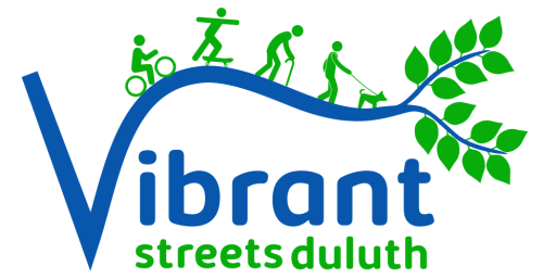 The logo for Vibrant Streets Duluth shows the word "Vibrant" in blue with an illustration showing a biker, skateboarder, dog walker and older walker with a cane heading toward leafy branches.
