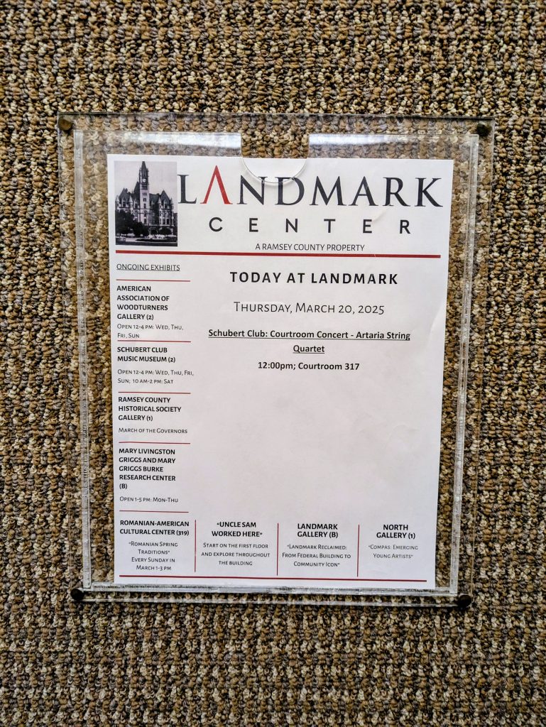 Posted printout of “Today at Landmark” for Thursday, March 20, 2025 including Courtroom Concert information