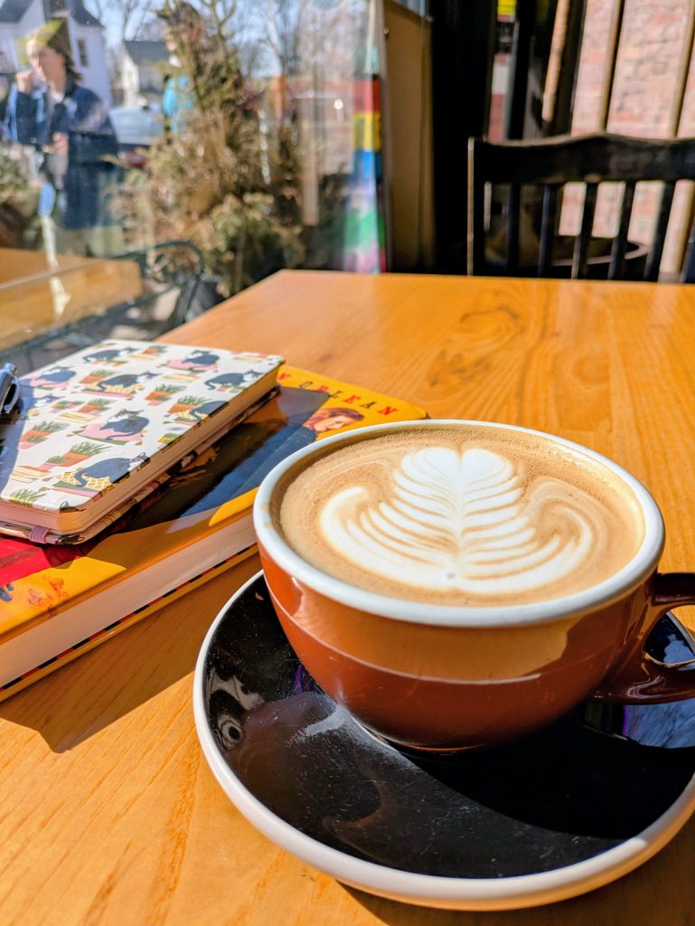 A cup of coffee near the window at Claddagh Coffee