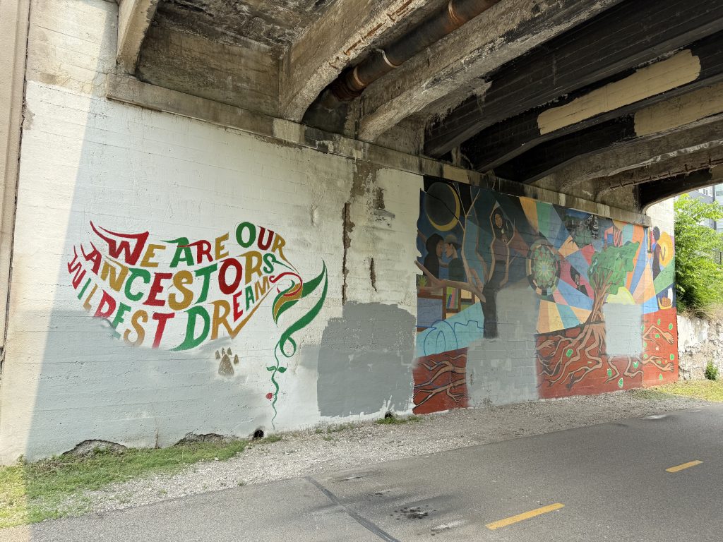 Mural painted under bridge at 11th Avenue.