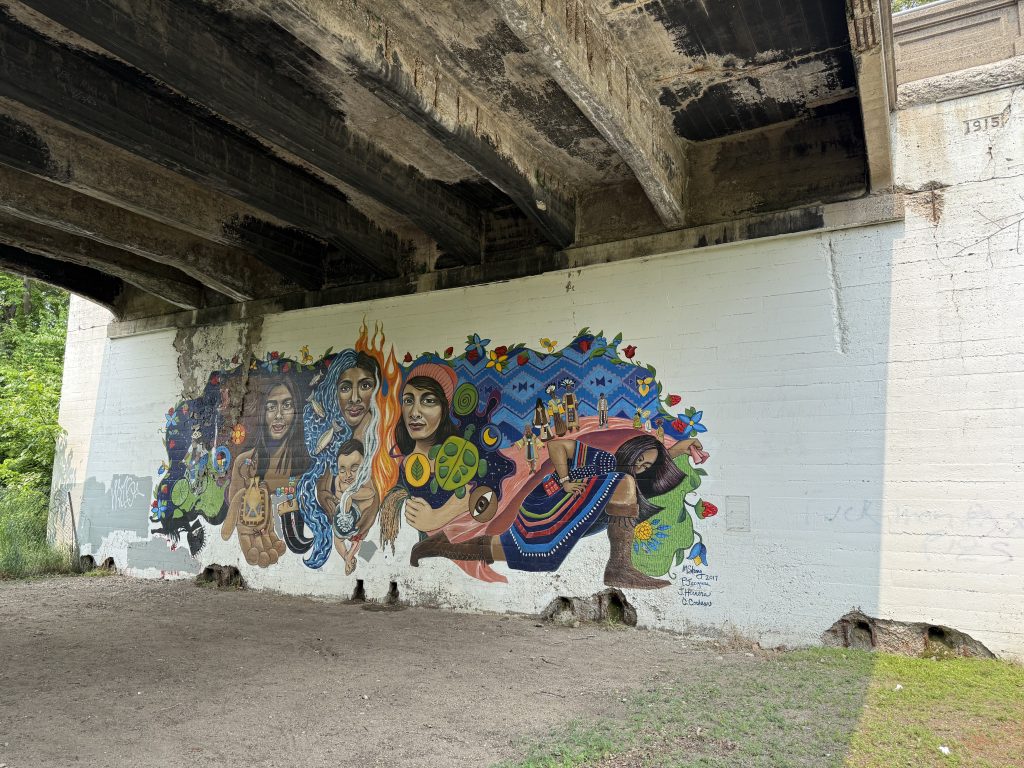 Mural painted under bridge at 13th Avenue.