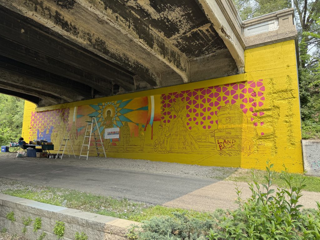 Mural painted under bridge at 14th Avenue.