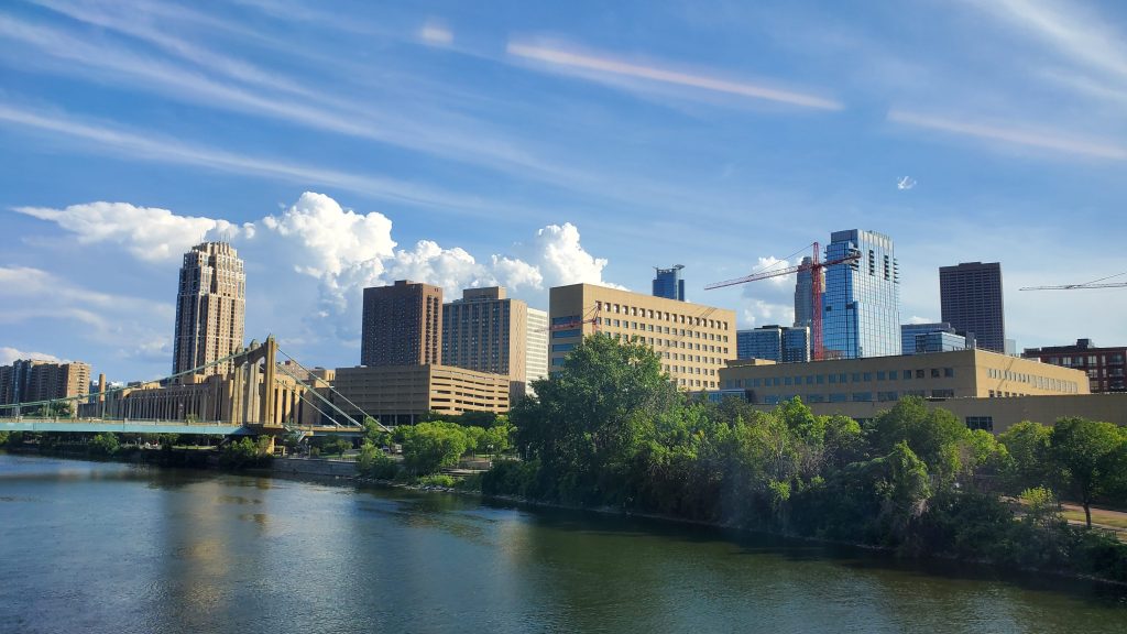 View of the Minneapolis skyline on the rail bridge over the Mississippi River.