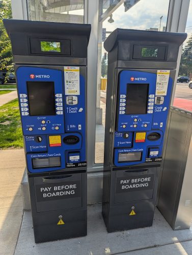 Two fareboxes at a BRT station.