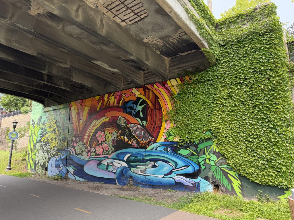 Mural painted under bridge at Colfax Avenue.