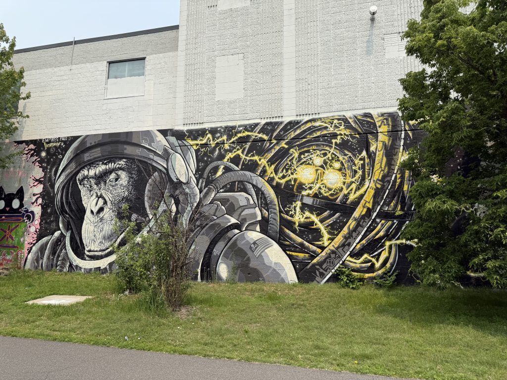 Mural painted between Harriet and Grand Avenues.