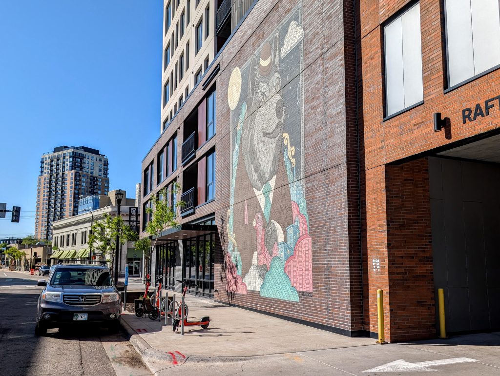 Building with a Bear mural flanked by other elements