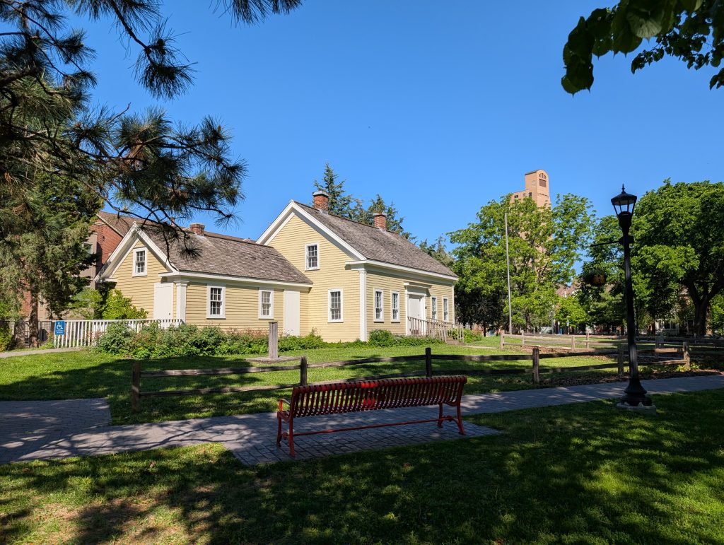 1 1/2-story wood frame house with attached outbuilding.