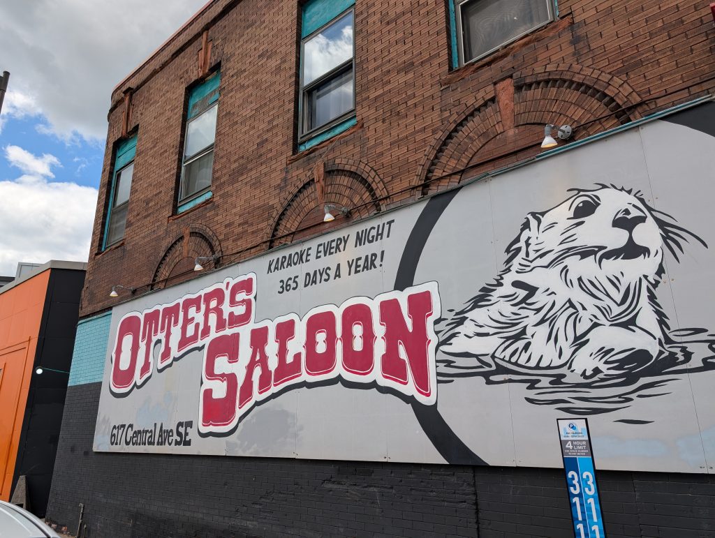 Sign on "Otter's Saloon, 617 Central Ave SE; Karaoke every night 365 days a year!"