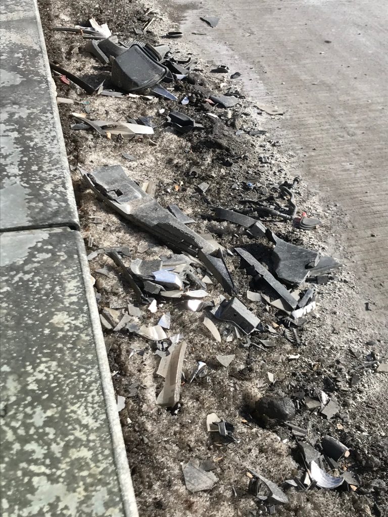 Vehicle debris on a roadside