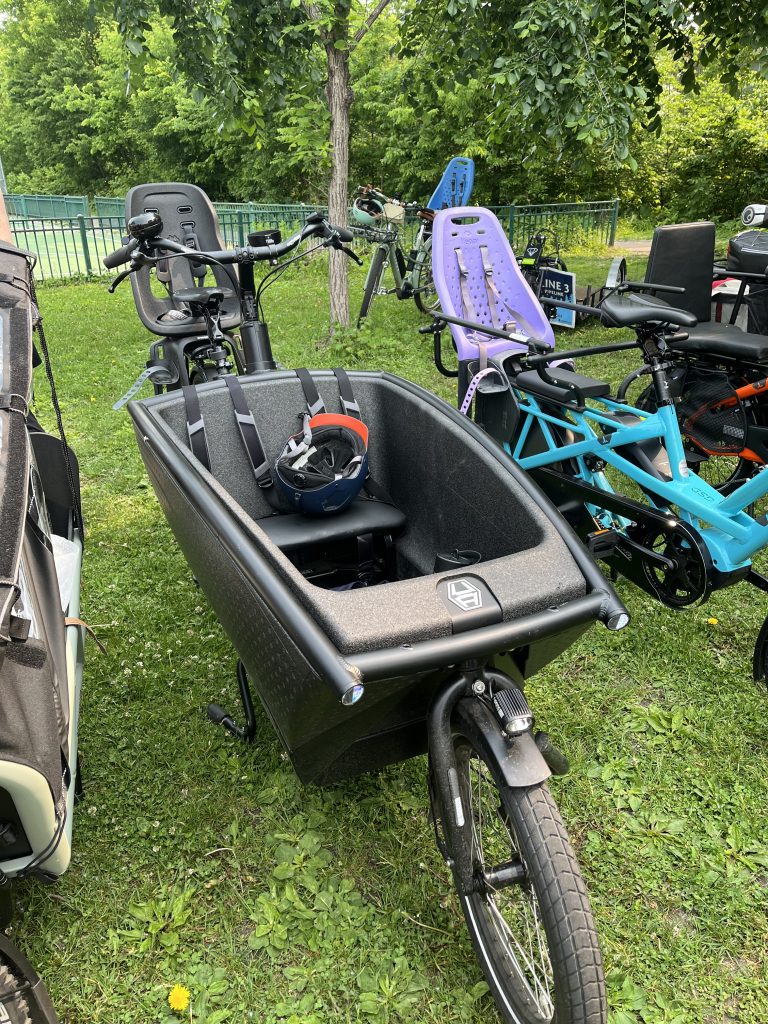 A cargo bike with a front basket for safely transporting up to two children. 