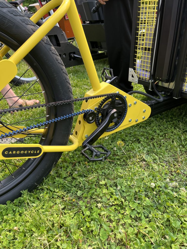A close-up of a bicycle chain modified to accommodate cargo hauling.
