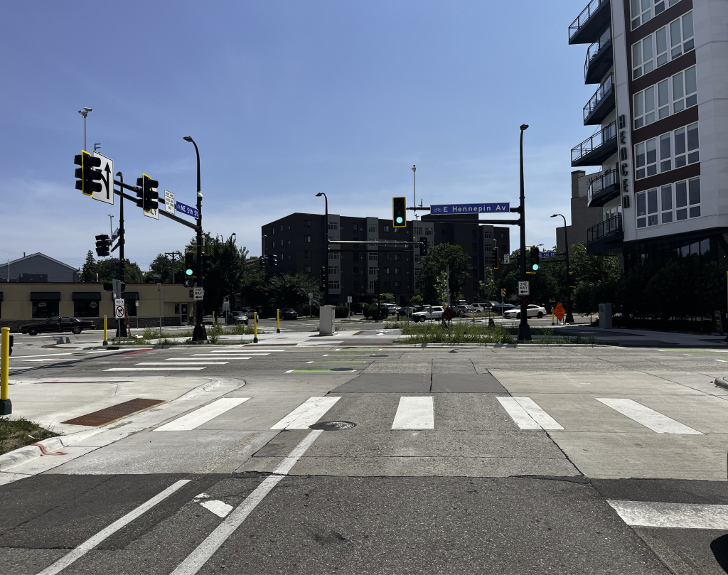 Major intersection at Hennepin Avenue with city buildings in the background.