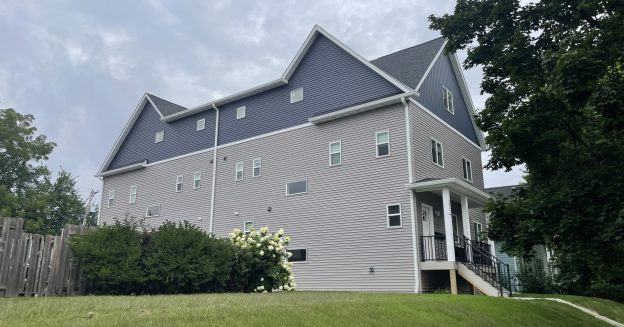 A side view of a three-story building constructed recently to house students.