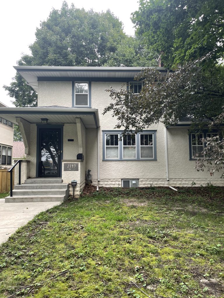 A white two-story house on Selby Avenue in St. Paul