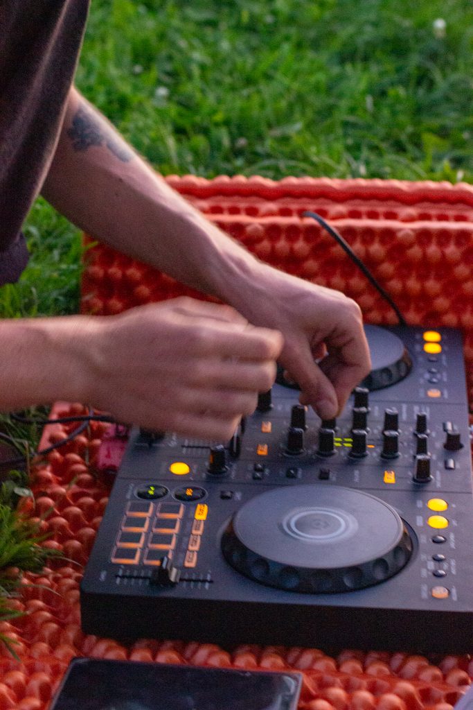 At the final location, a DJ (disc jockey) set up a portable turntable with big speakers to play dance music to cap off the night
