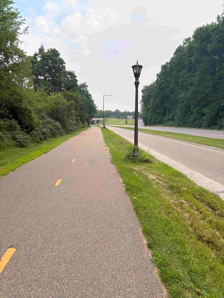 Looking south, a view of the two-way Ayd Mill Trail alongside one lane for traffic coming into St. Paul.