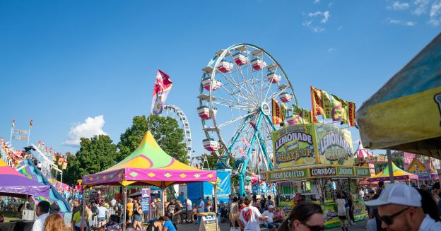 Blue sky serves as a backdrop for colorful rides at the Minnesota State Fair.