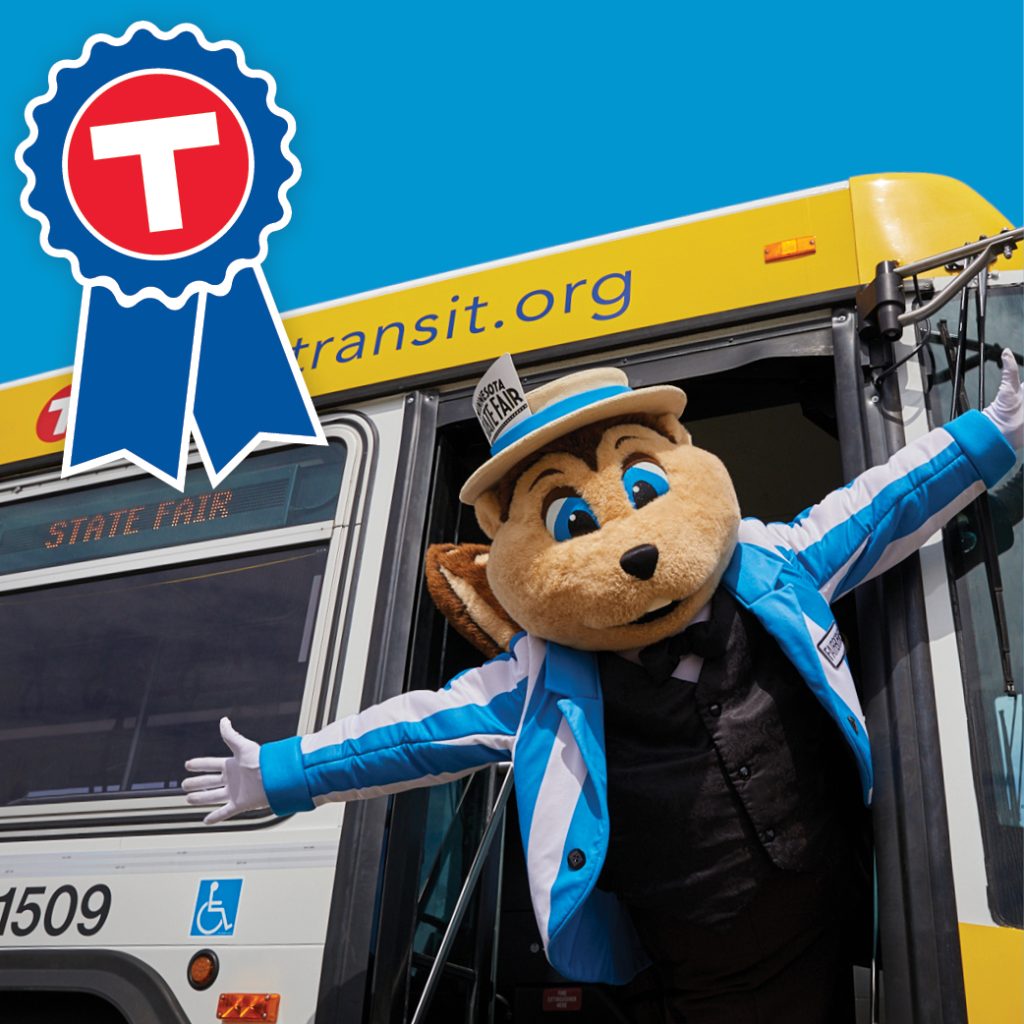Metro Transit State Fair mascot leaning out of a bus.