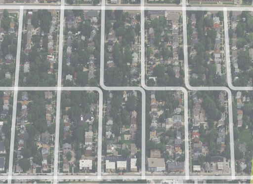 An aerial view of a residential neighborhood street grid in the Como area, showing several intersections where vehicles are forced to turn rather than proceeding straight through.