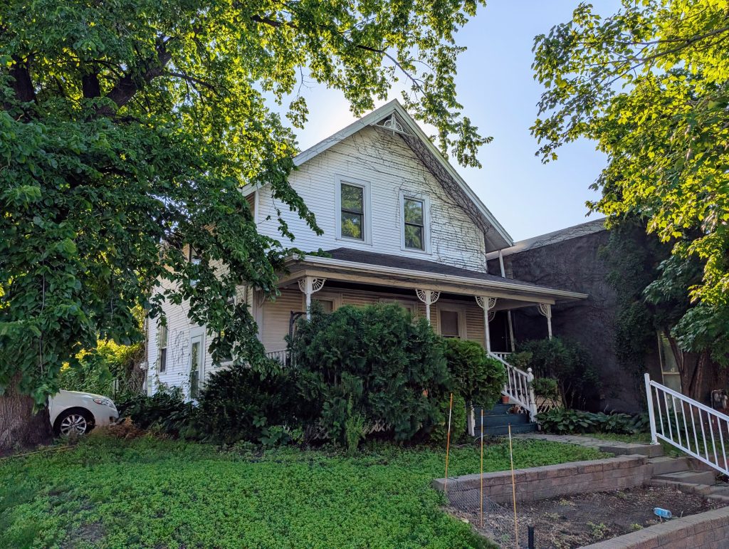 Two-story white house with front porch